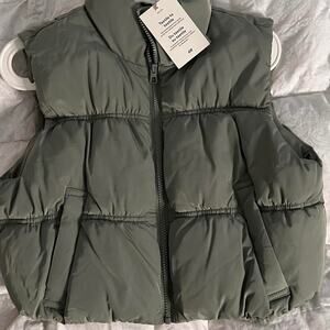 Green puffer vest with pockets